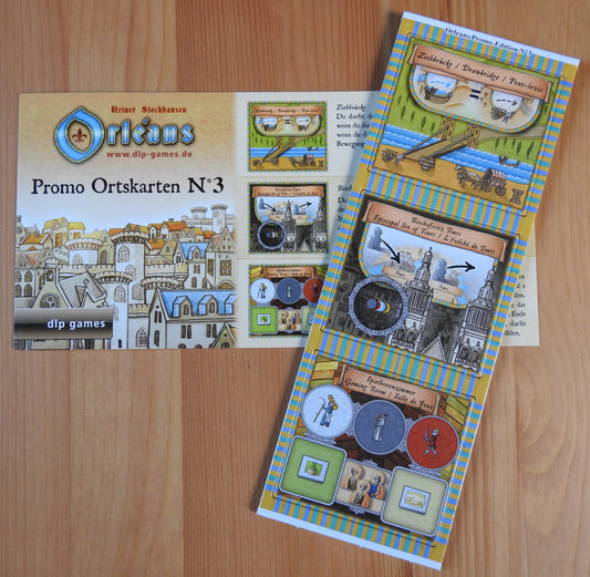Top view showing the three place tiles in the Orleans Promo No.3, along with the rules card.