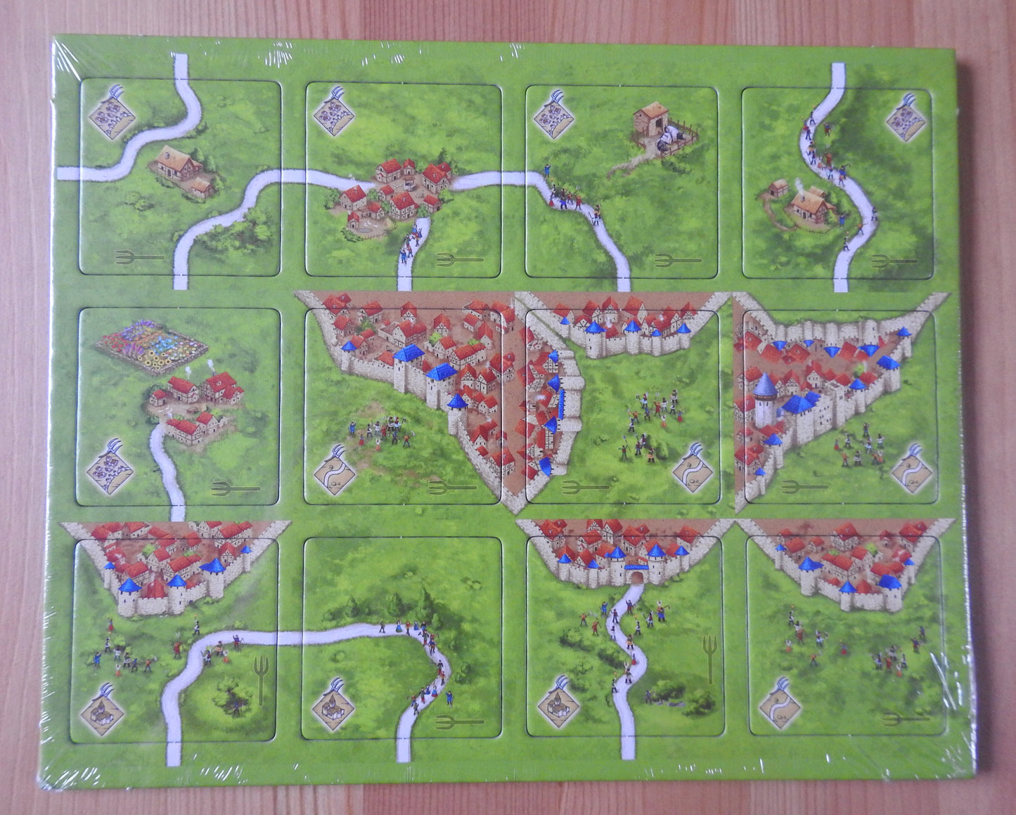 Top view of the 12 tiles included in this Peasant Revolts mini expansion.