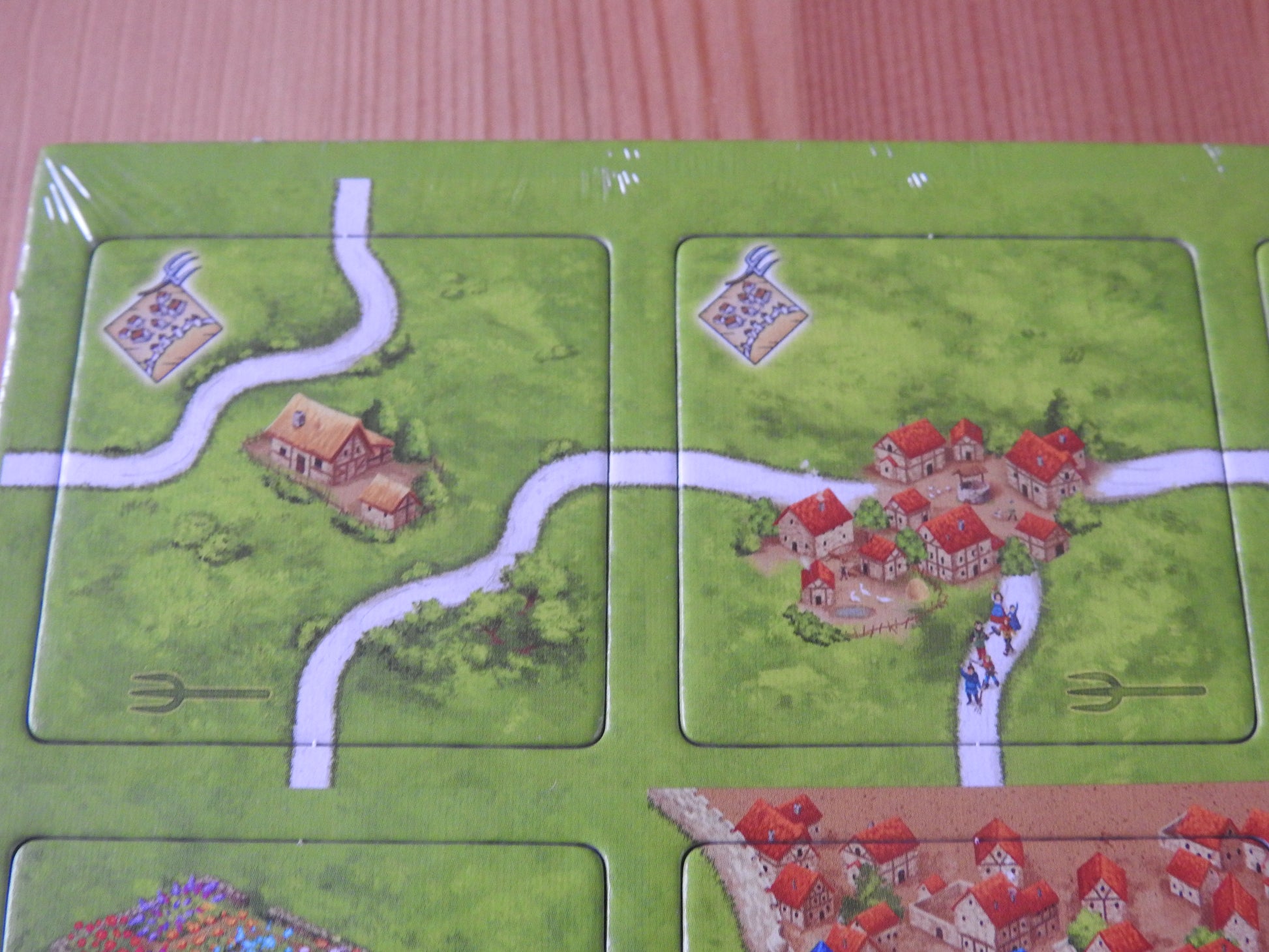 Close-up of 2 more tiles, showing roads, houses and an angry mob!
