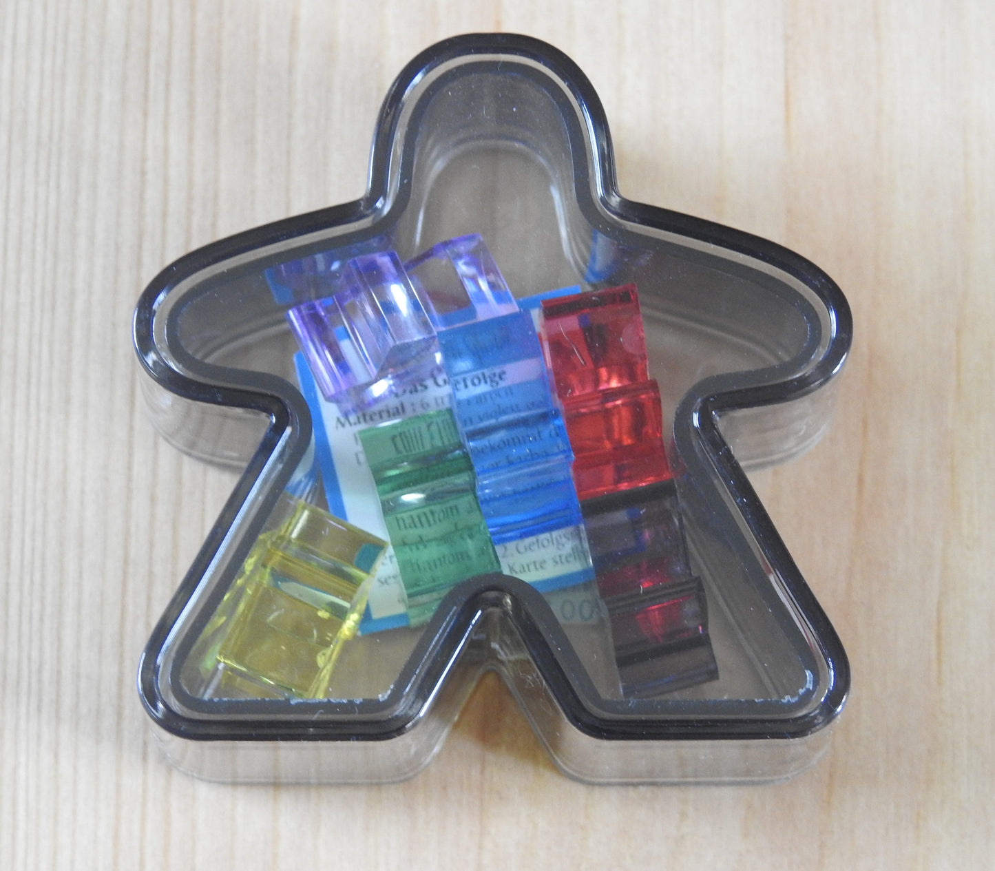 Black Meeple box with the six mini meeples shown inside!