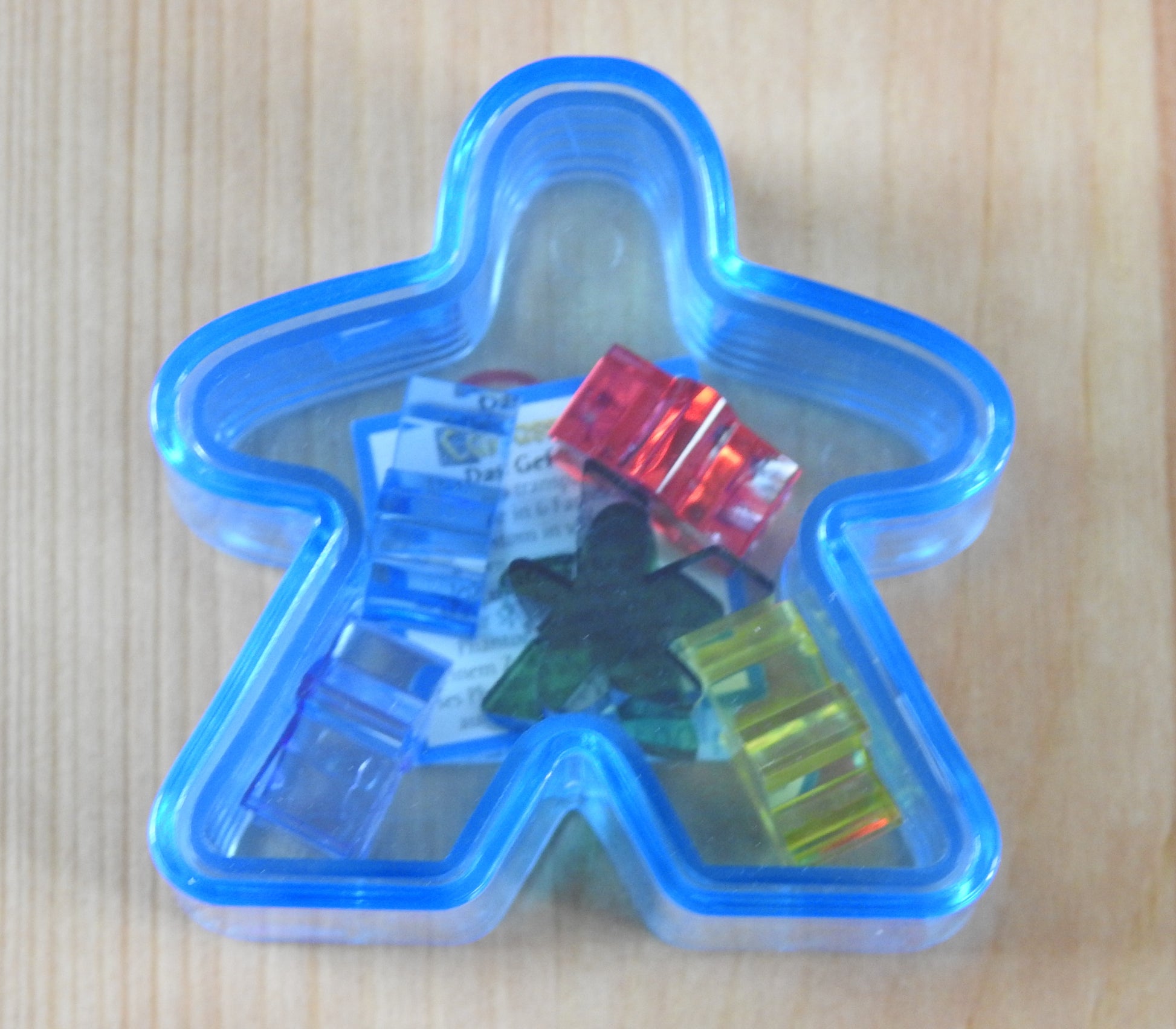 Blue Meeple box with the six mini meeples shown inside!