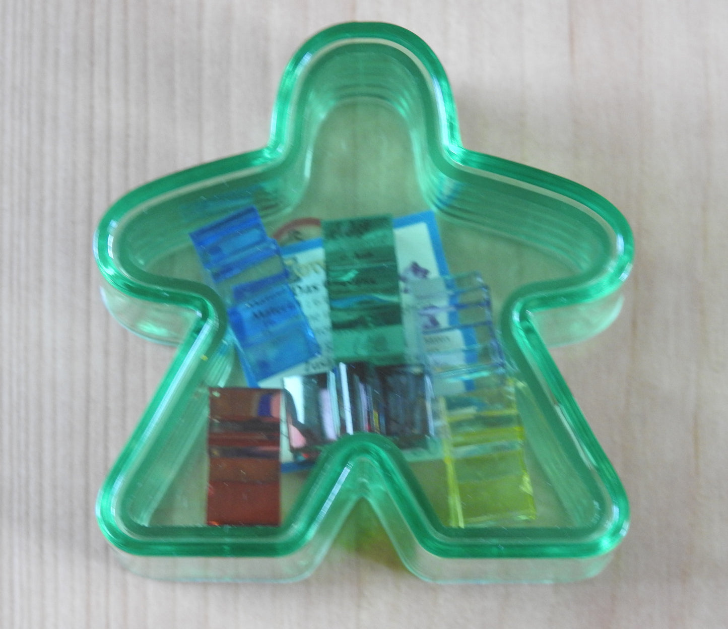 Green Meeple box with the six mini meeples shown inside!
