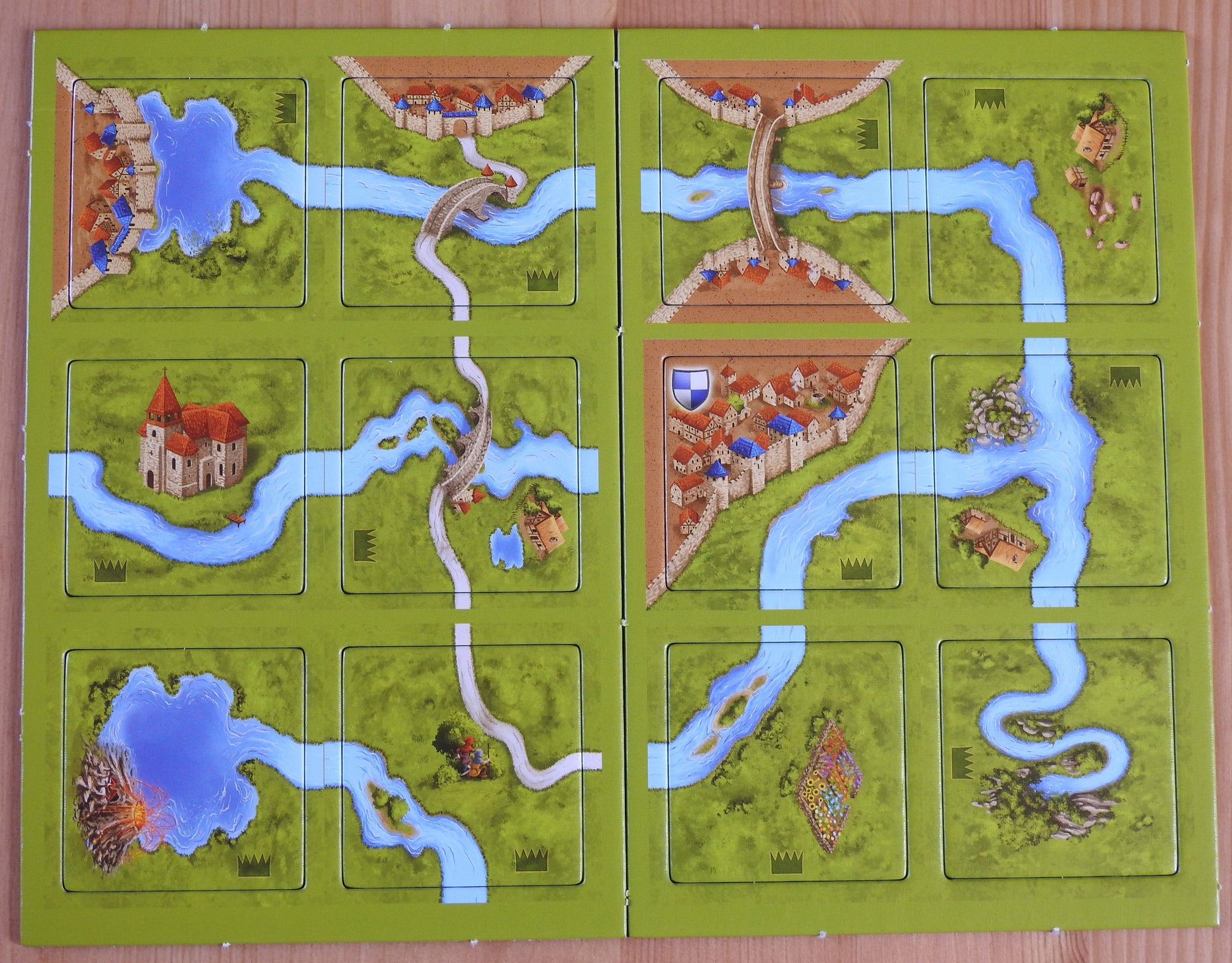 Top view of the 12 tiles that come with this River II Carcassonne Mini Expansion.