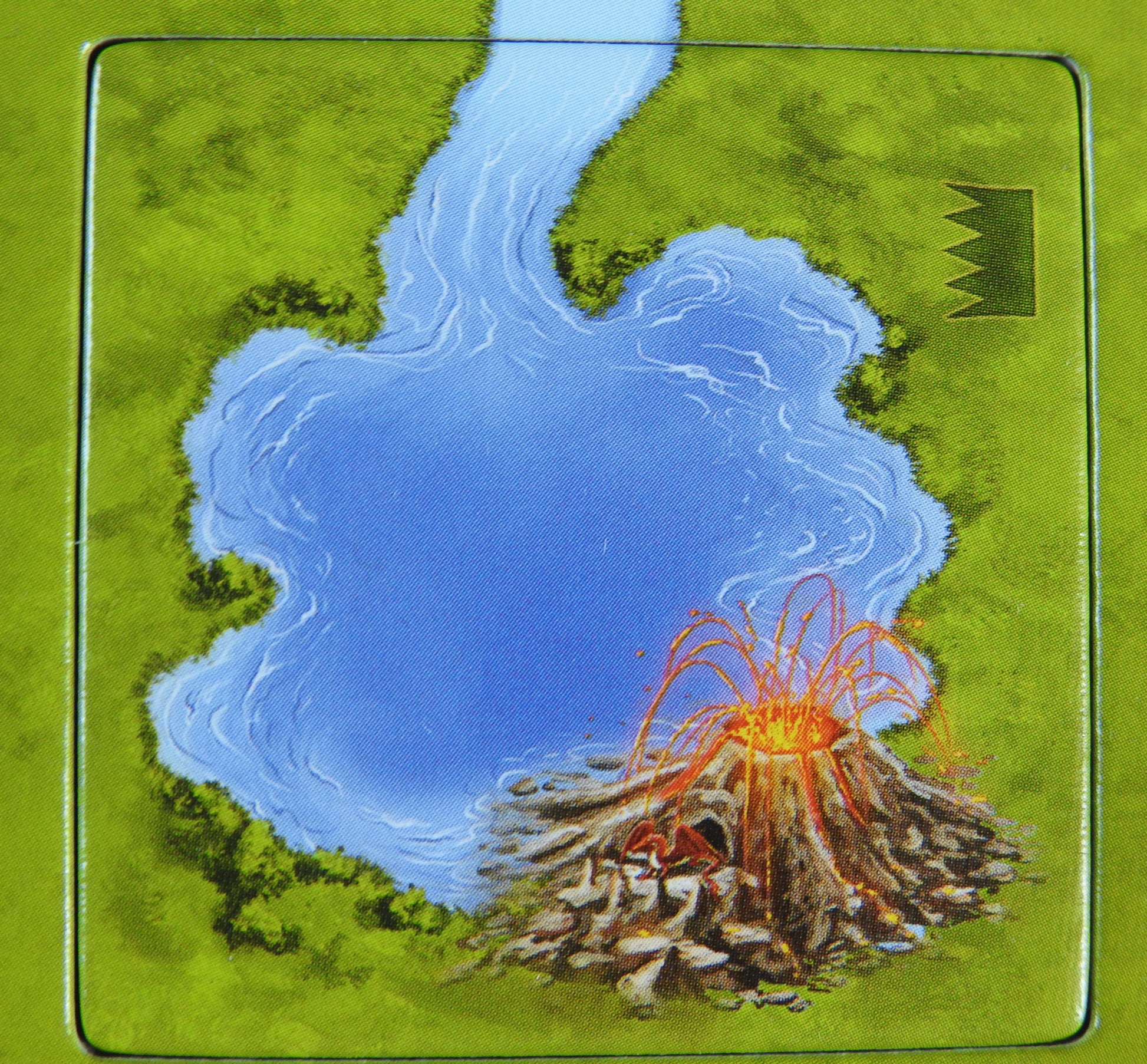 Close-up view of the volcano tile, showing it erupting next to a lake!