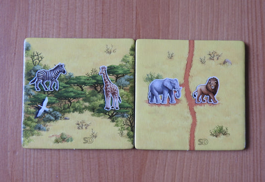 View of the 2 promo tiles included in this Carcassonne Safari mini expansion.