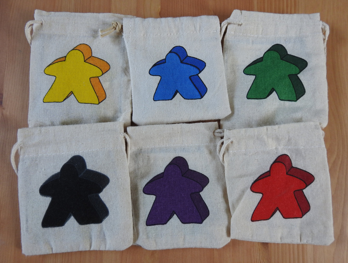 Close-up of the all 6 meeple bag colours to choose from.