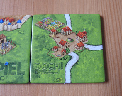 A closer view of the 'Doch' tile featuring a lovely abbots garden as part of this mini expansion for Carcassonne.