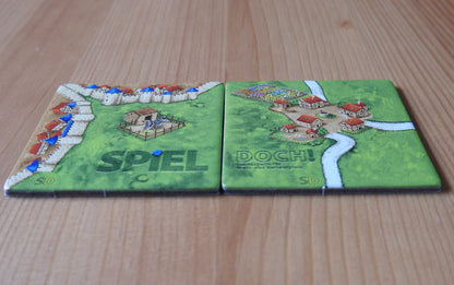 Another view showing both tiles at a different angle that are featured in this Spiel Doch promo mini expansion for Carcassonne.