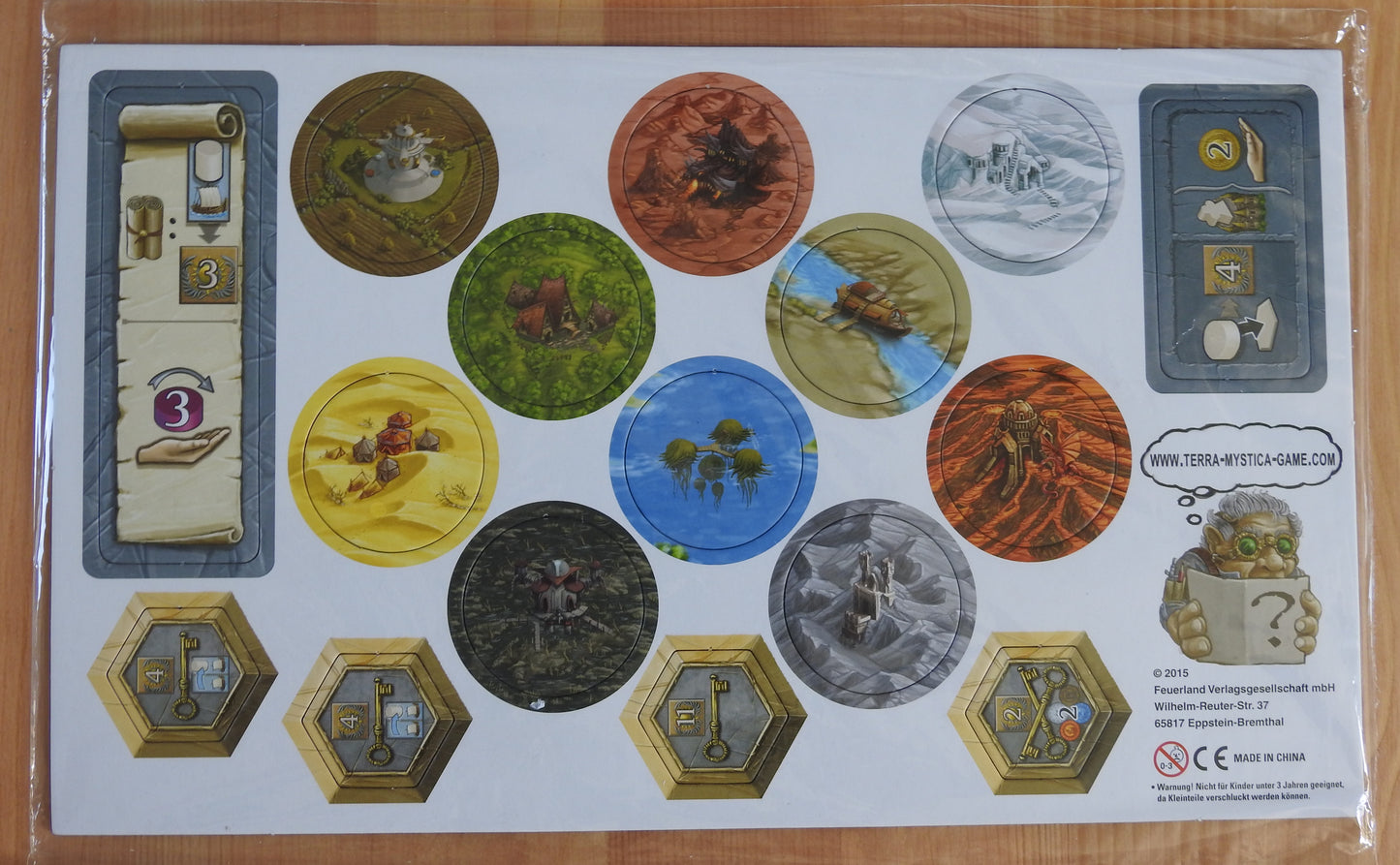 The tiles and tokens included with this Terra Mystica mini expansion 4 promo bundle.