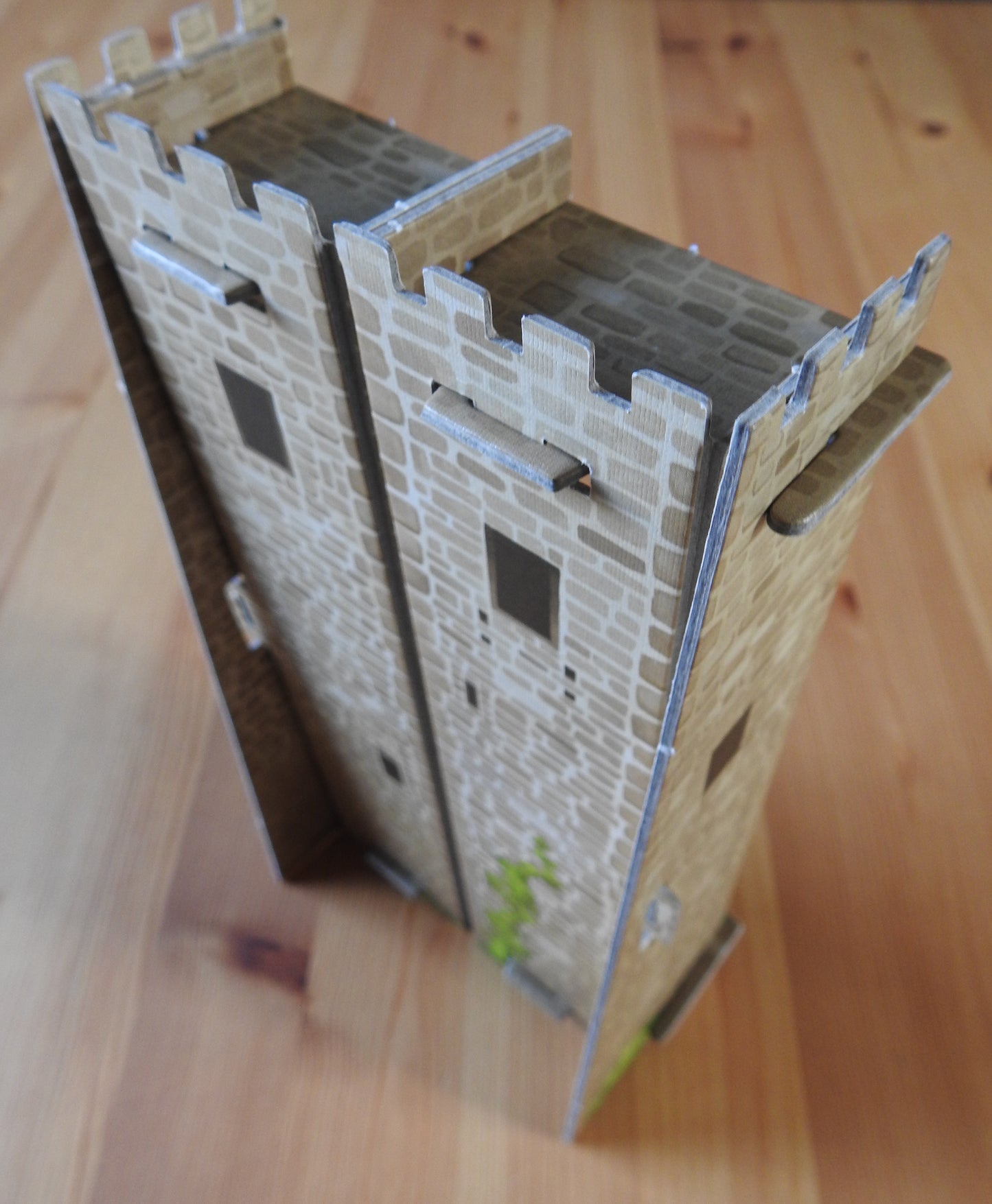 View showing the back of the Tile Tower accessory for Carcassonne, which is shaped like a castle tower.