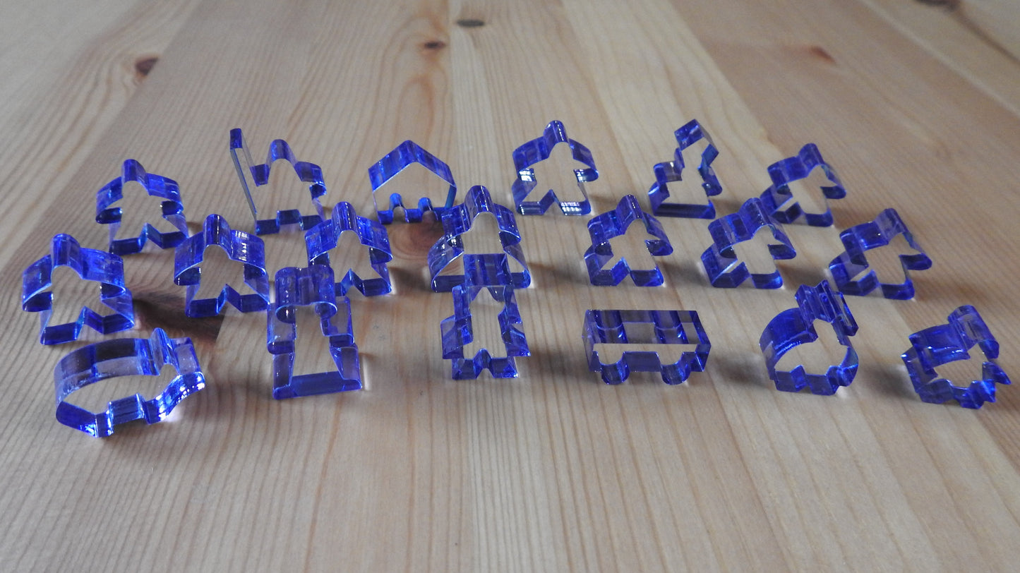 Close-up view of the blue transparent meeple set.