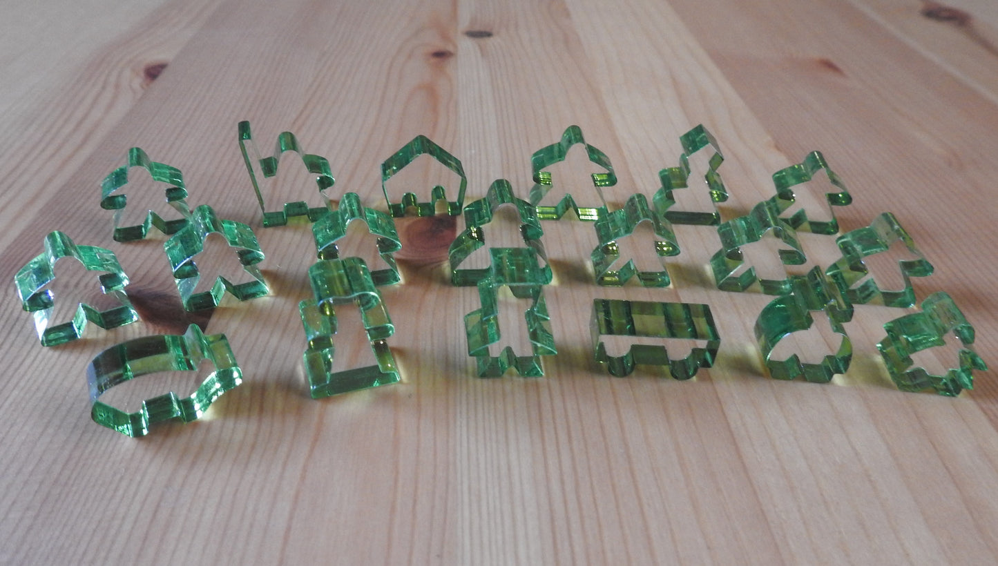 Close-up view of the light green transparent meeple set.