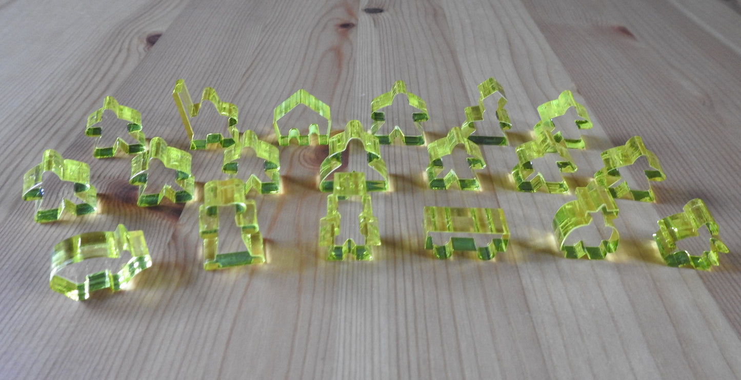 Close-up view of the yellow transparent meeple set.