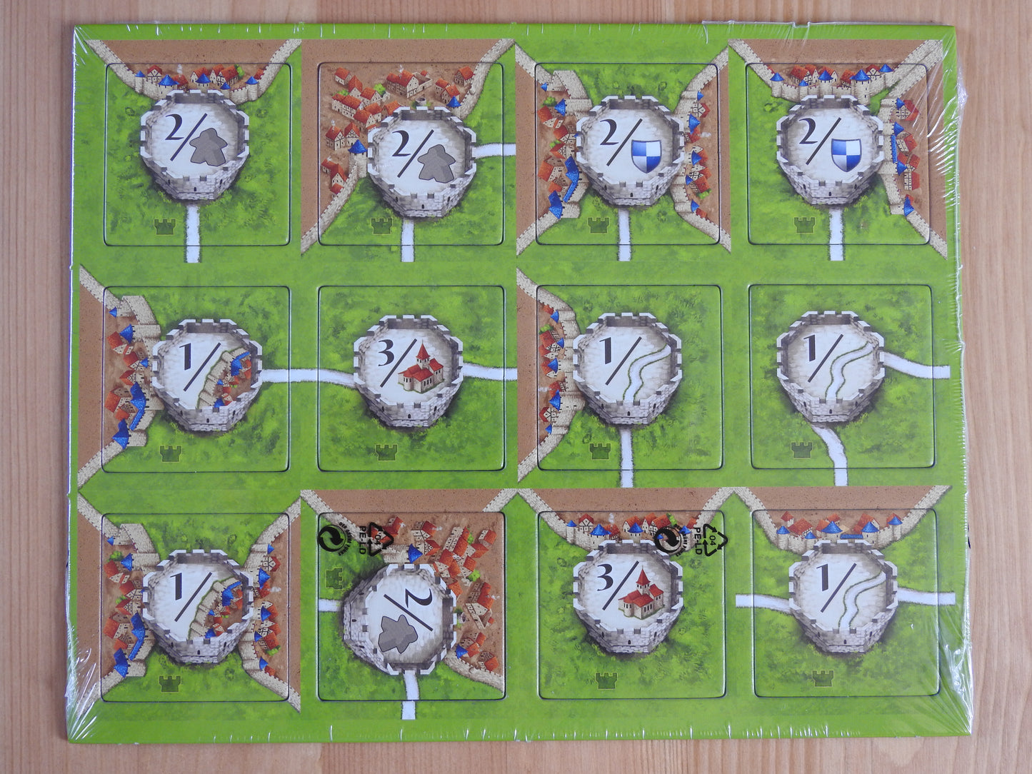 Top view of the 12 watchtower tiles included in this Watchtowers Carcassonne Mini Expansion.