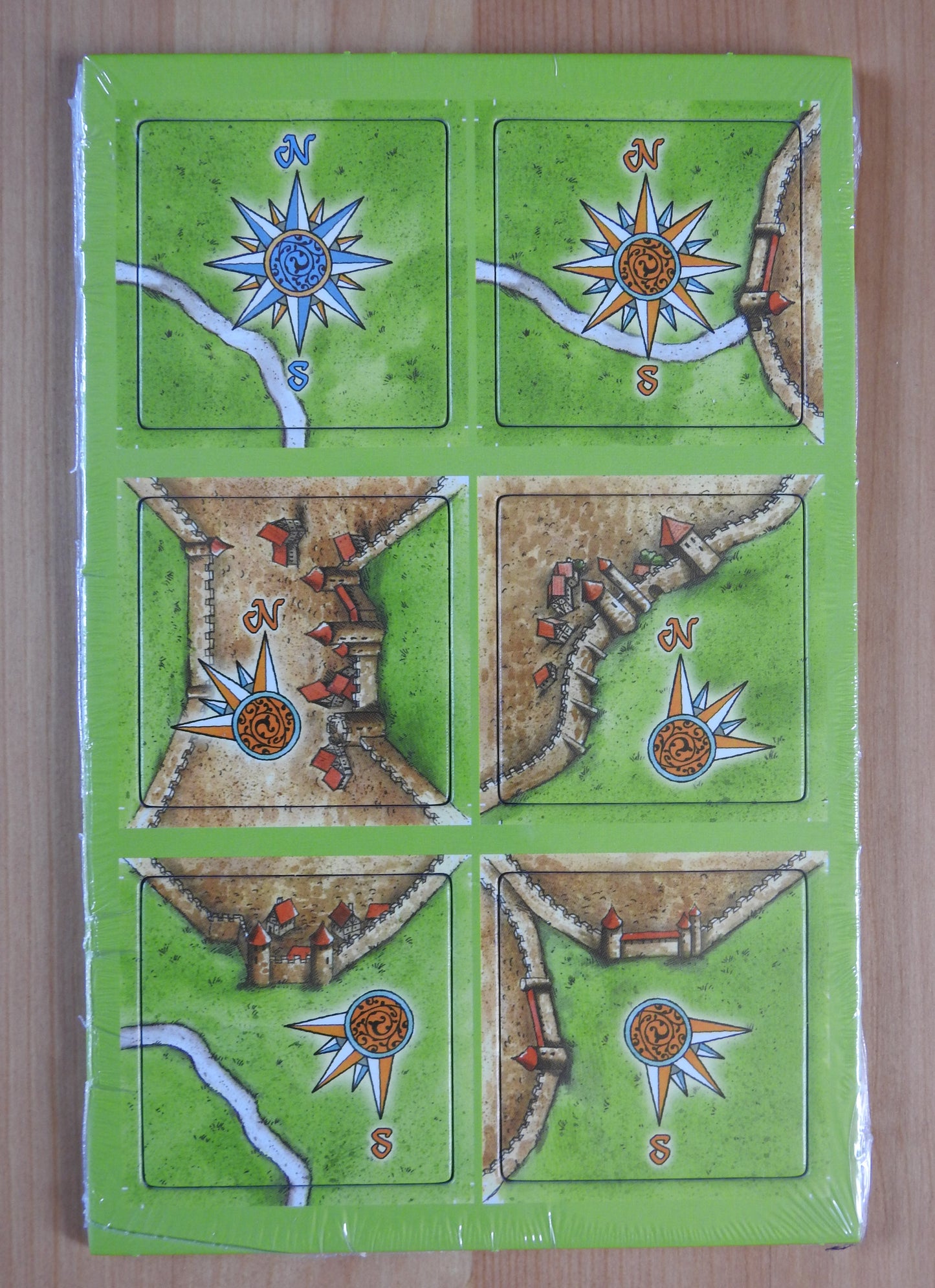Top view of the 6 windroses tiles making up the Windroses Carcassonne Mini Expansion.
