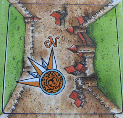 Close-up view of a city windrose tile showing the north direction on the compass.