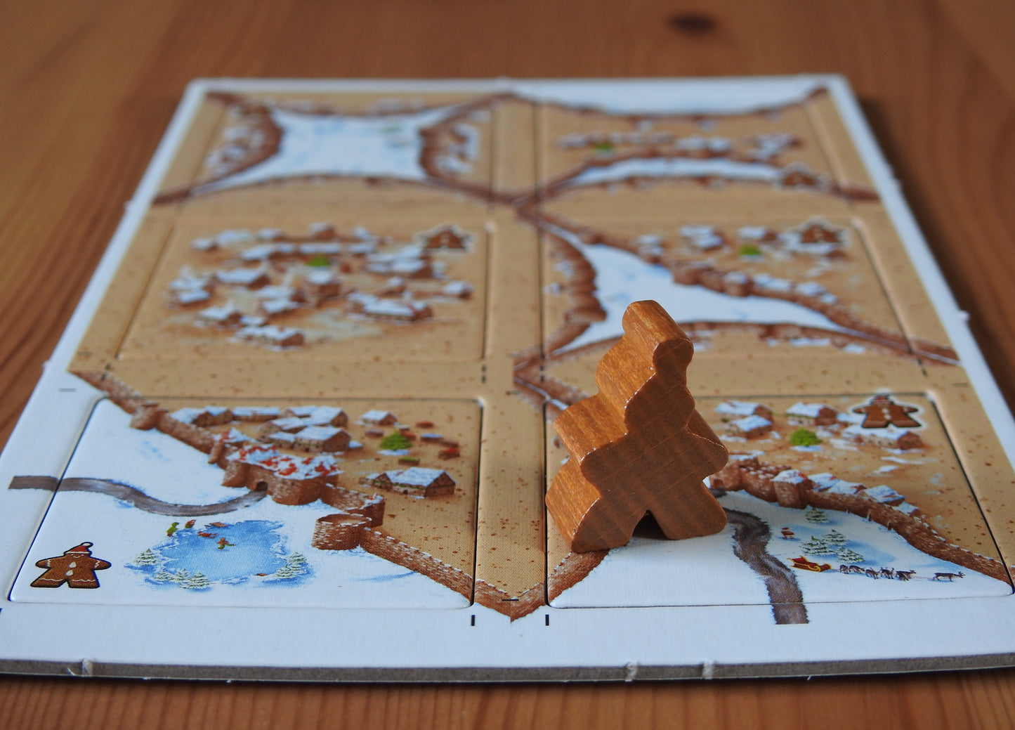 Another view of all the tiles and the gingerbread meeple figure.