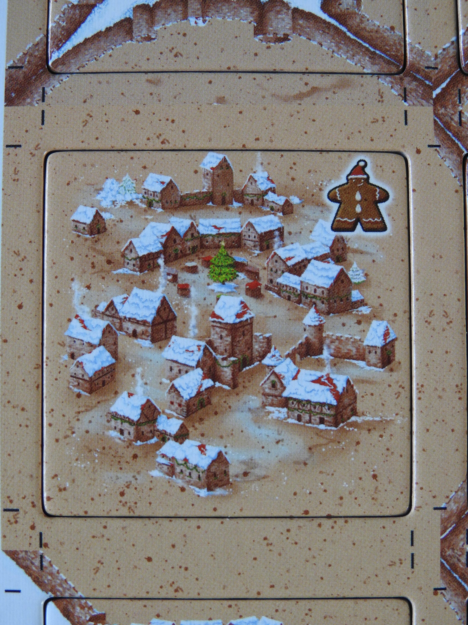 Close-up view of one of the city tiles included, with beautiful artwork of snow-dusted roofs.