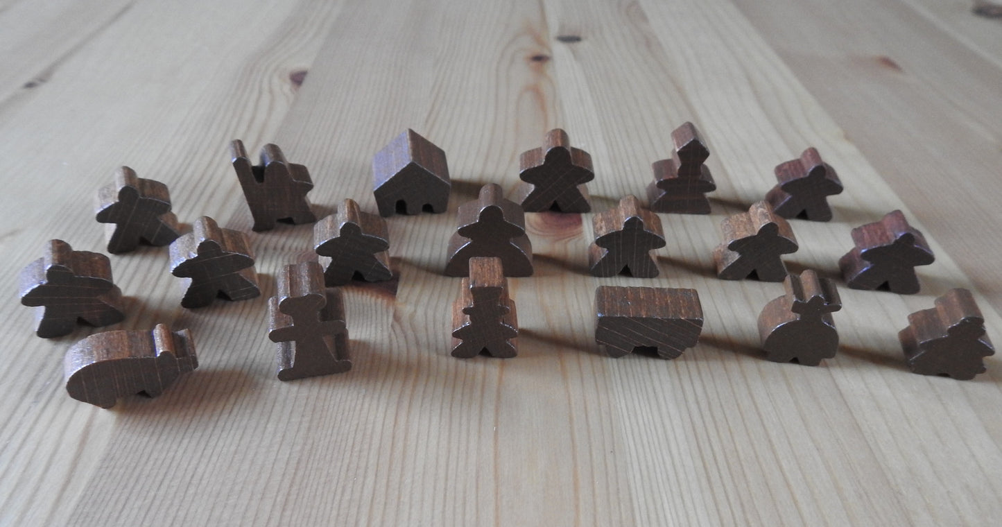 Close-up view of the brown wooden meeple set.